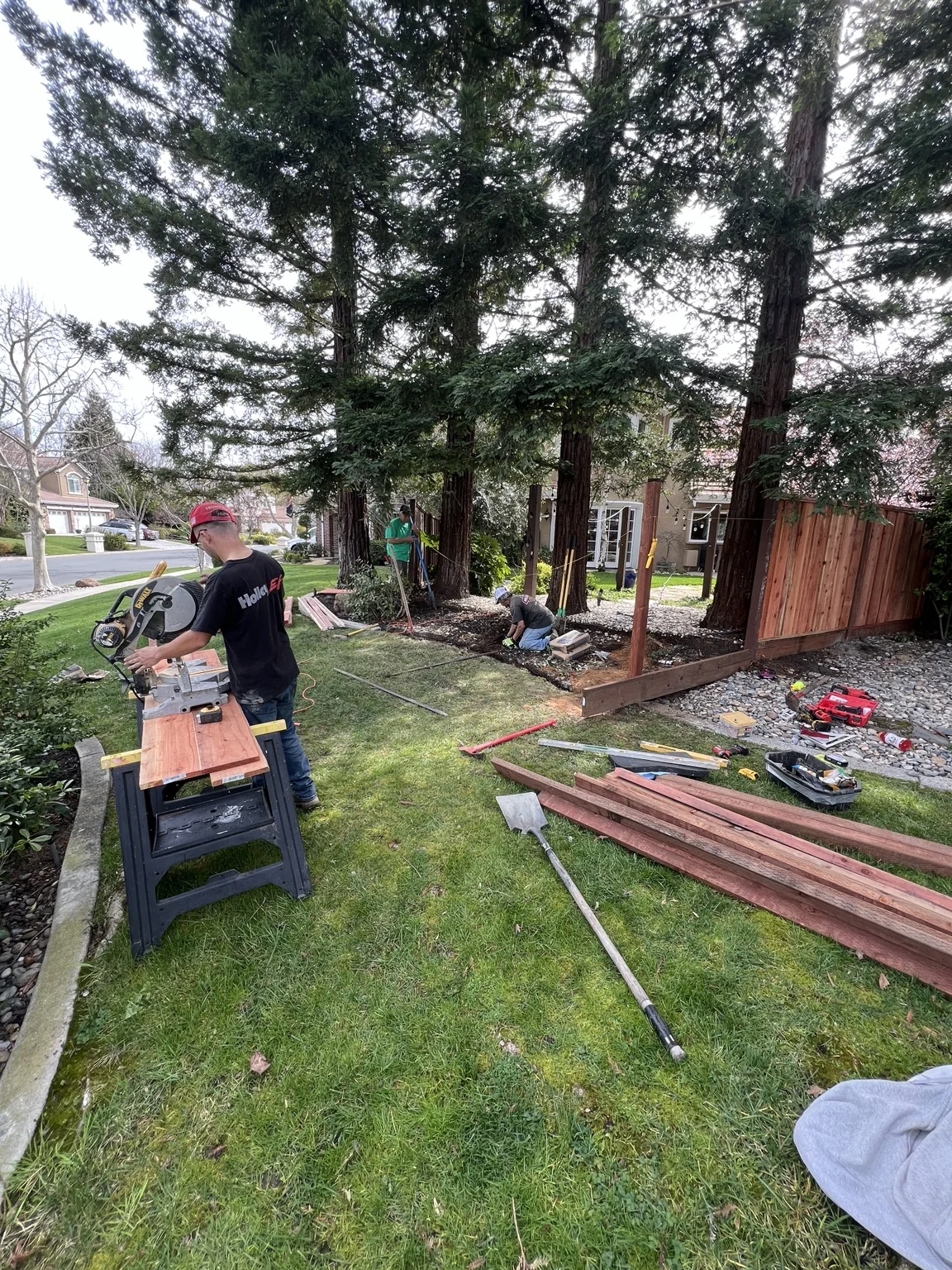 JL Landscaping crew installing a fence